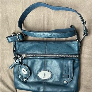Fossil, medium size, leather, cross body or purse in blue.